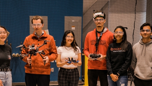 Students with professor in drone lab