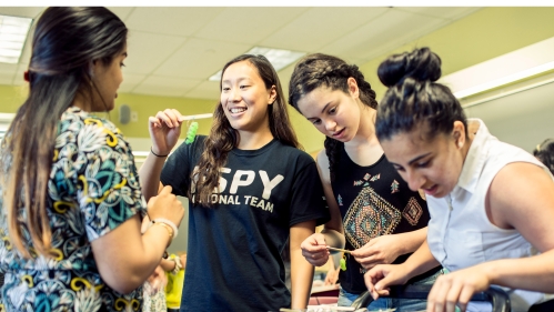 Female students working on experiment