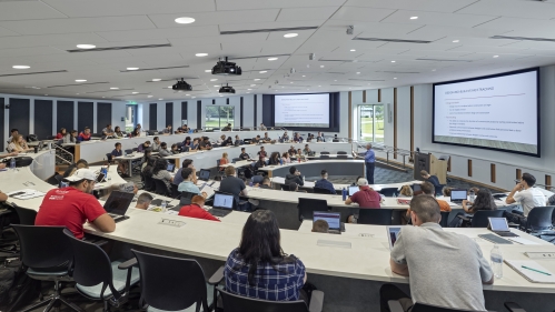 Professor in front of students in smart classroom