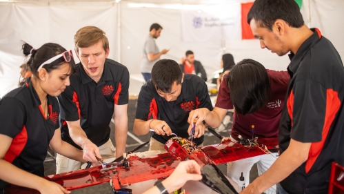 Students working on plane