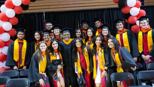 Group of Honors Academy students posing for picture before their graduation ceremony.