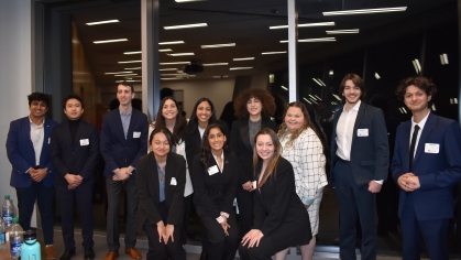 Group of 20 engineering students all wearing suits.