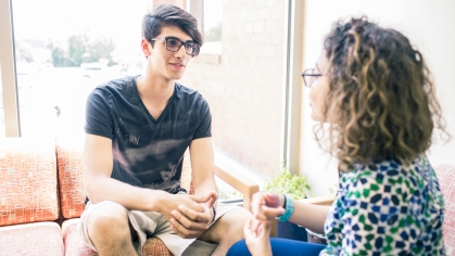 male student being advised by female counselor