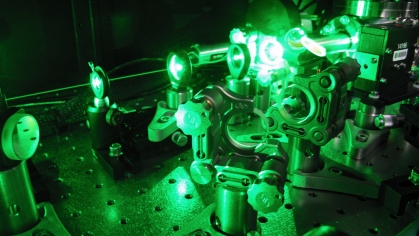 laser equipment green lit against black background.