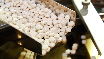 Closeup of pharmaceutical medicine tablet pill production