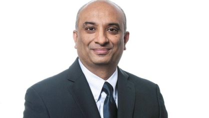Headshot of male wearing a suit and tie.