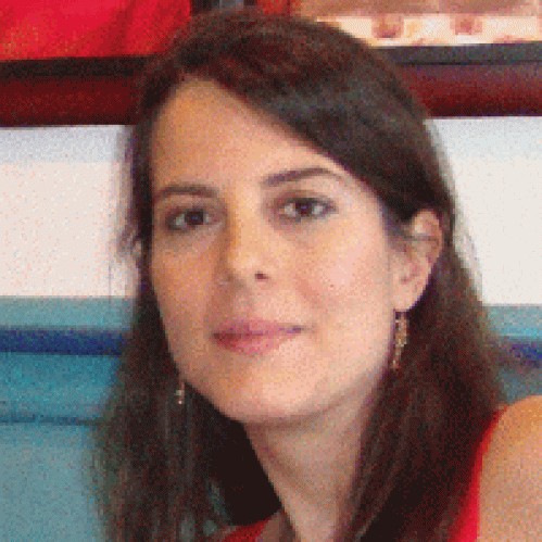 Headshot of woman with long brown hair.
