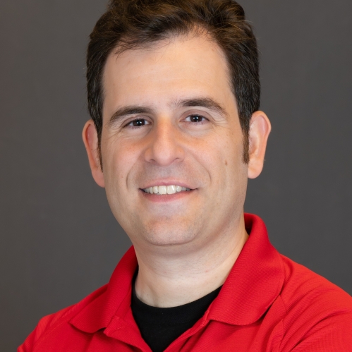Headshot of male with short brown hair, wearing a red Rutgers School of Engineeirng polo shirt.