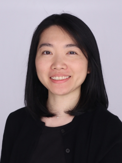 Head shot of Asian woman with shoulder length black hair wearing a black pullover sweater.