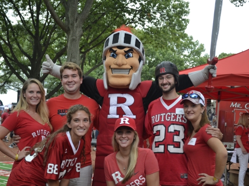 Scarlet Knight with group of football tailgaters