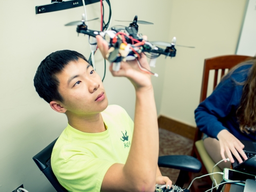 Male student working on drone
