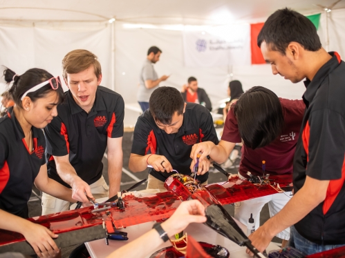 Students working on plane