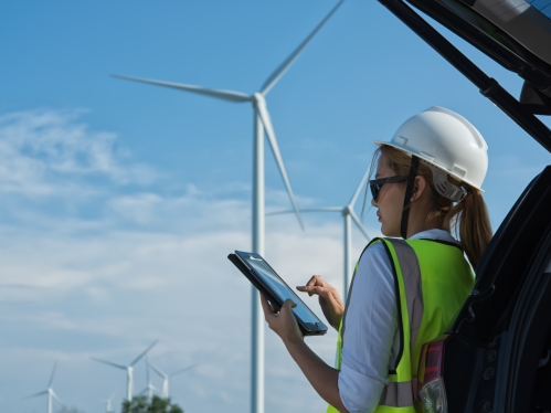 woman engineerworking in wind turbine farm