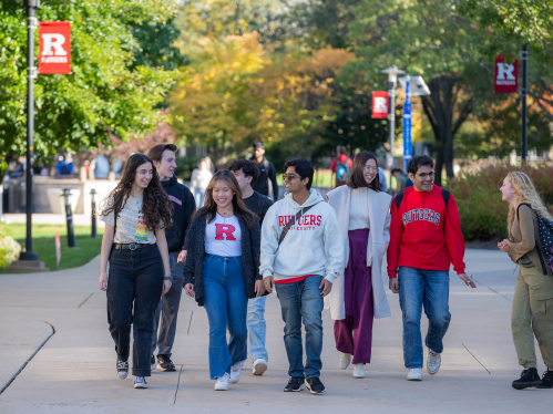 A group of Rutgers students walking together on campus
