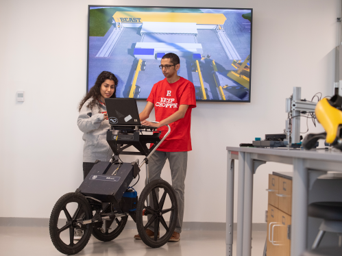 Students on a laptop in the CAIT bridge testing lab