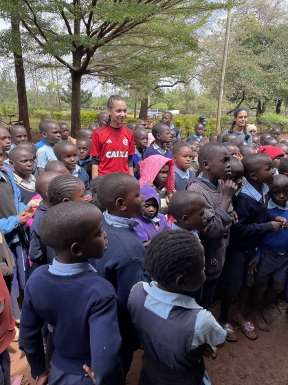 Rutgers student with children in Africa