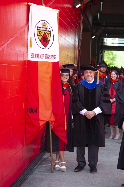 The School of Engineering students and dean in graduation regalia on standby by for the academic procession in SHI Stadium.