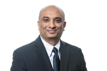 Headshot of male wearing a suit and tie.