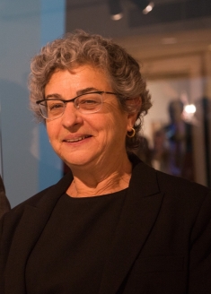 Head shot of a woman, Lisa Klein, wearing eyeglasses and a dark sweater.